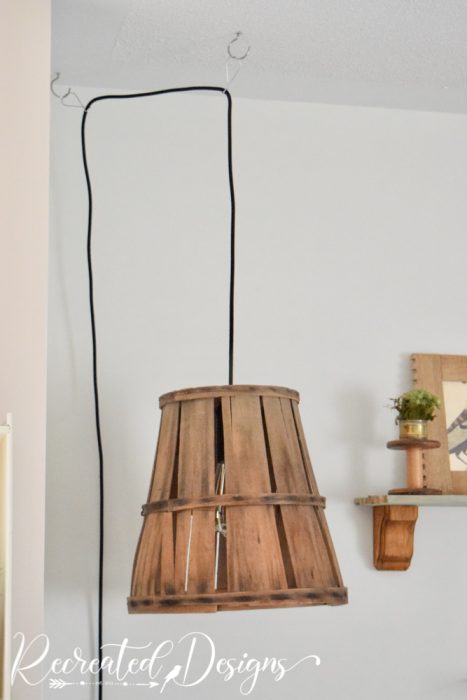 https://www.recreateddesigns.com/wp-content/uploads/2022/04/hanging-lamp-basket-ugly-cord-solution-Recreated-Designs-467x700.jpg