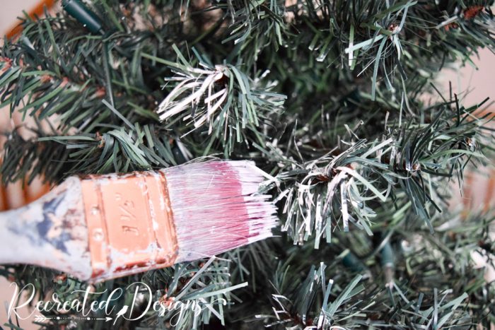 DIY Flocked Christmas Tree with White Spray Paint and Snow